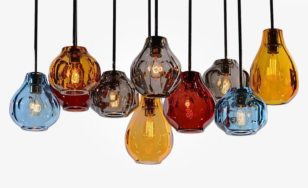 Cluster of multi-colored ceramic glass light fixtures hanging from the ceiling